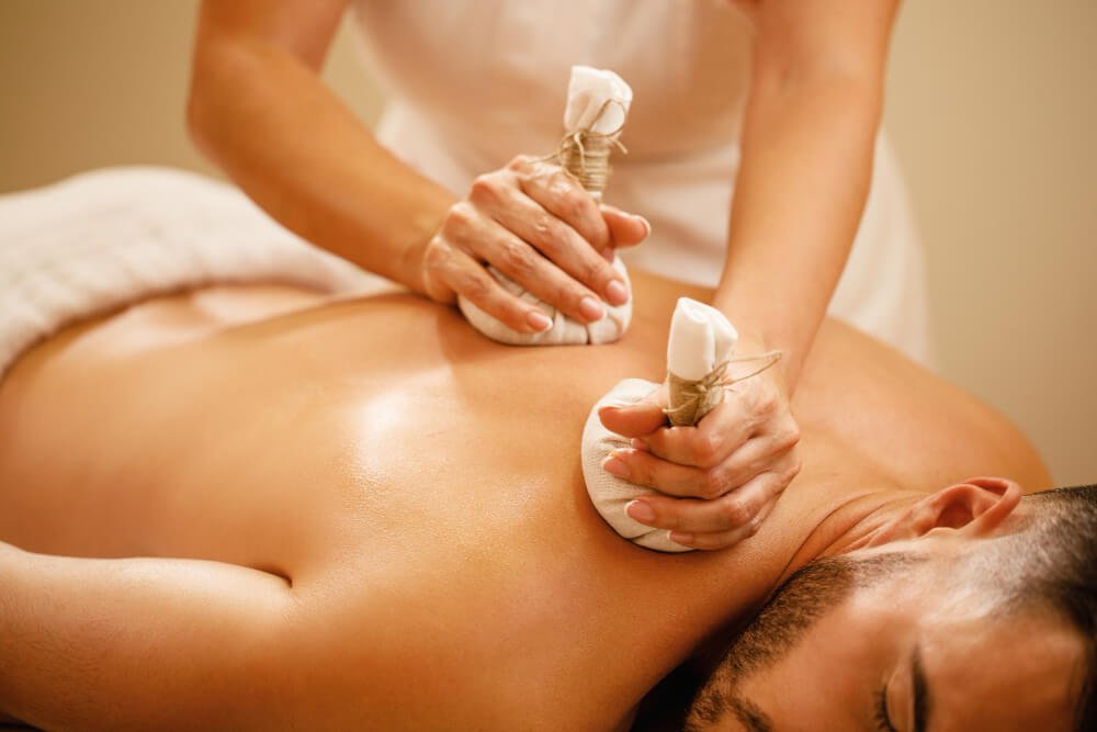 Man Getting Traditional Ayurvedic Shirodhara Therapy for Relaxation and Healing