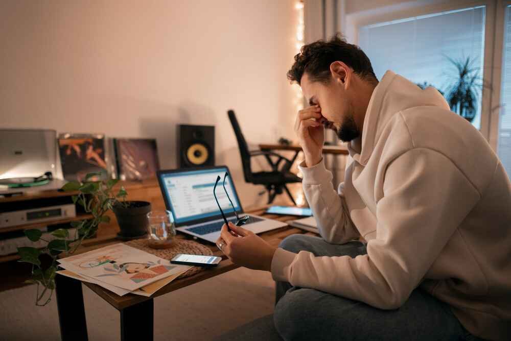 Man Feeling Stressed Due to Work-From-Home Fatigue