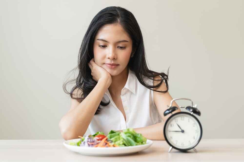 Woman Waiting For Her Eating Window to Start