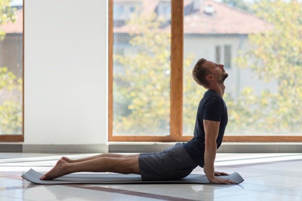 Man Practising Bhujangasana for Gut Health